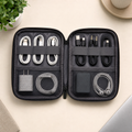 Open charcoal tech organizer pouch with cable compartments