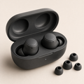 Charcoal wireless earbuds in an open charging case