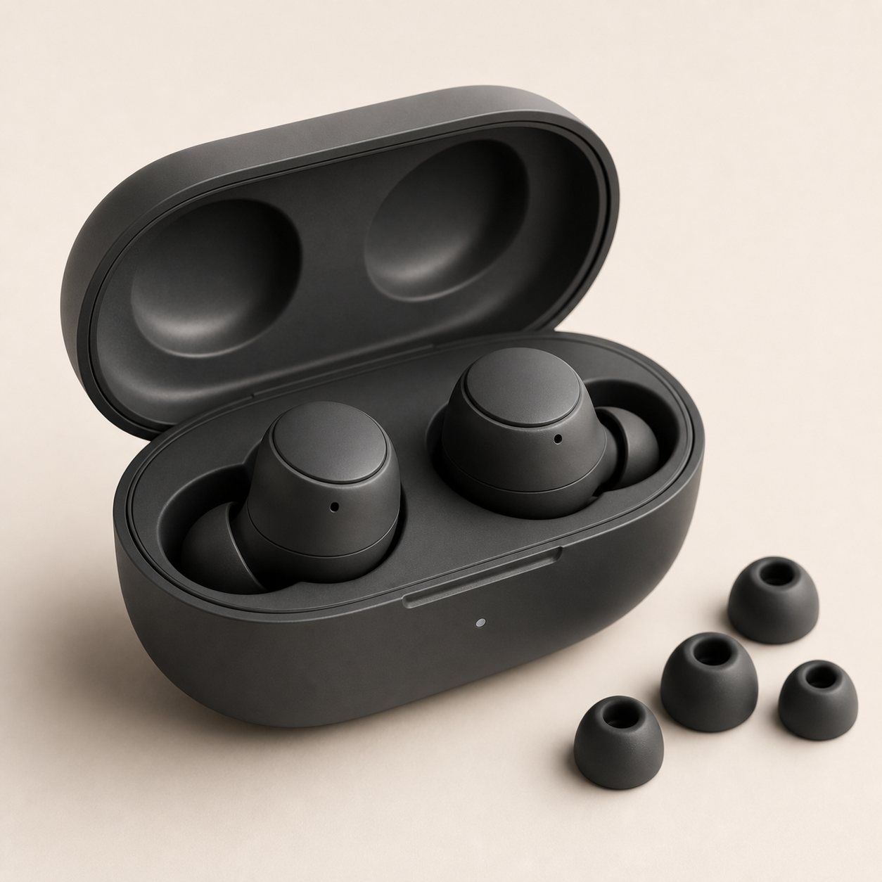 Charcoal wireless earbuds in an open charging case